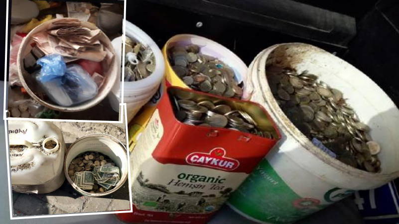 Полные ведра денег среди кучи мусора